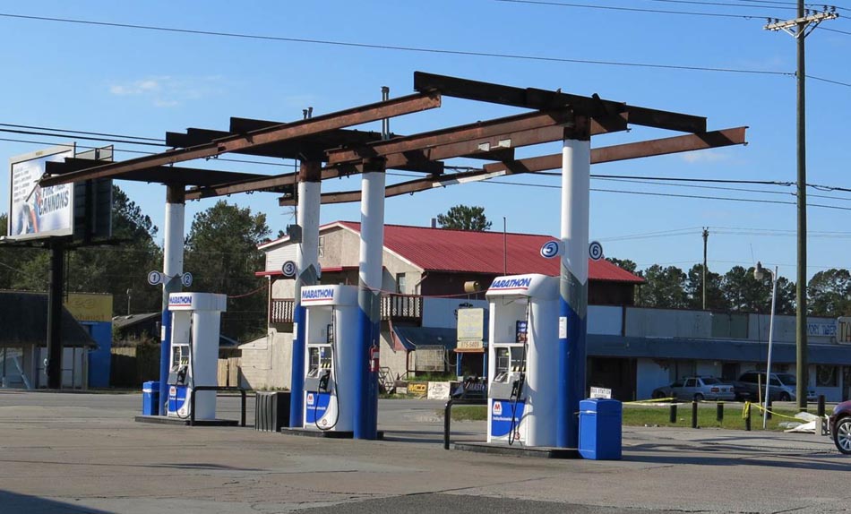 Significant wind damage to a gasoline filling station canopy