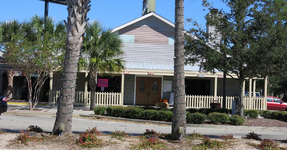 Missing siding on the gable end of a restaurant