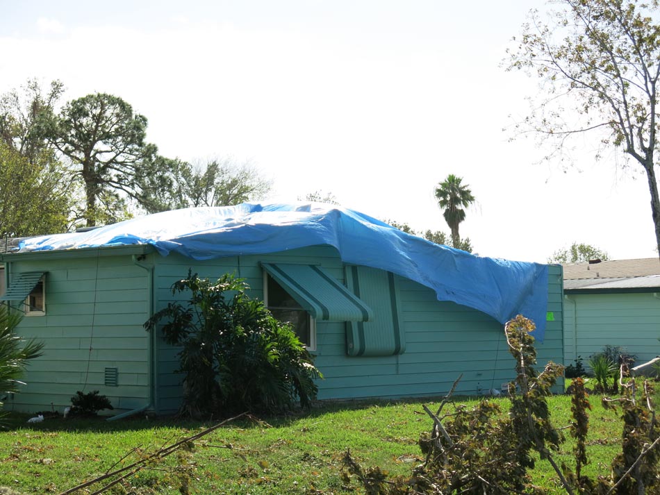 Tarp covers large section of the roof. Extent of the damage is unknown.