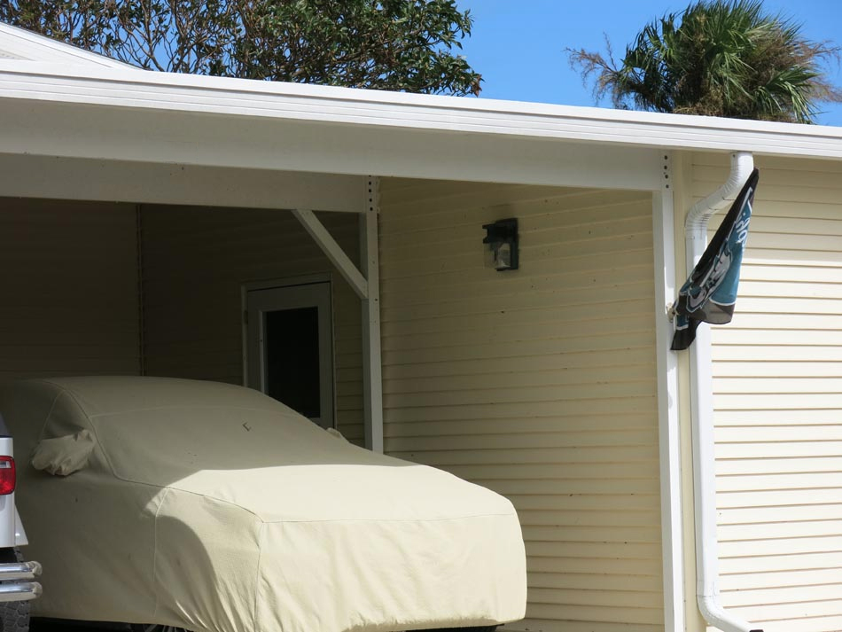 Undamaged carports show well engineered frame and braced system.