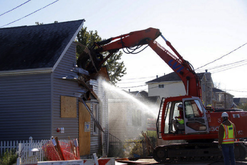 A property acquired through a buyout project being demolished