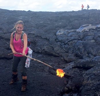 Alyssa poking lava with a stick