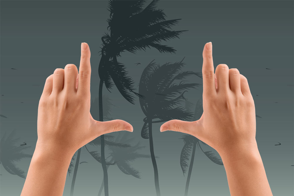Hands framing a storm